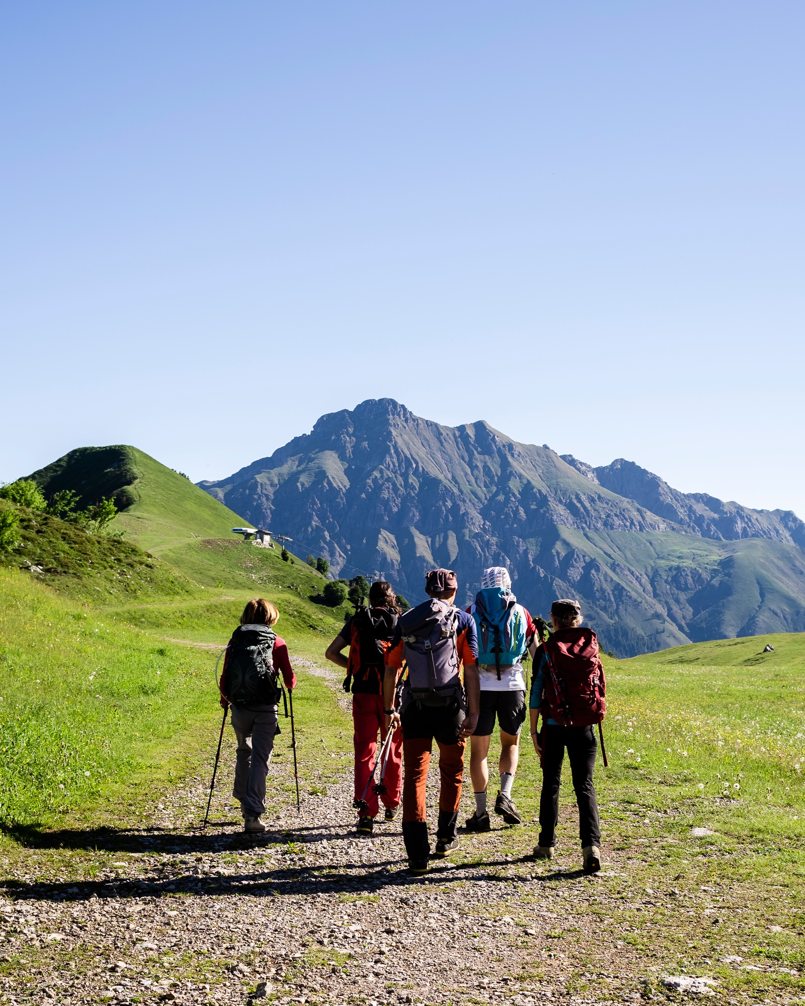 Group of hikers walking in the mountains, Orobie Mountains, Lecco, Italy